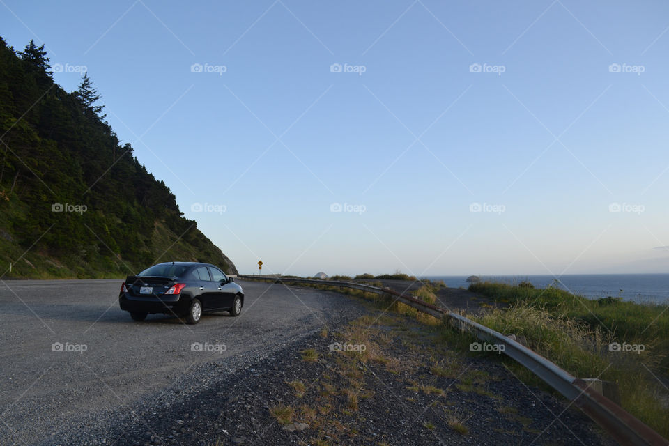 car parked by the cliff. Car parked by the cliff off route 1 in Oregon along the Pacific Ocean coast