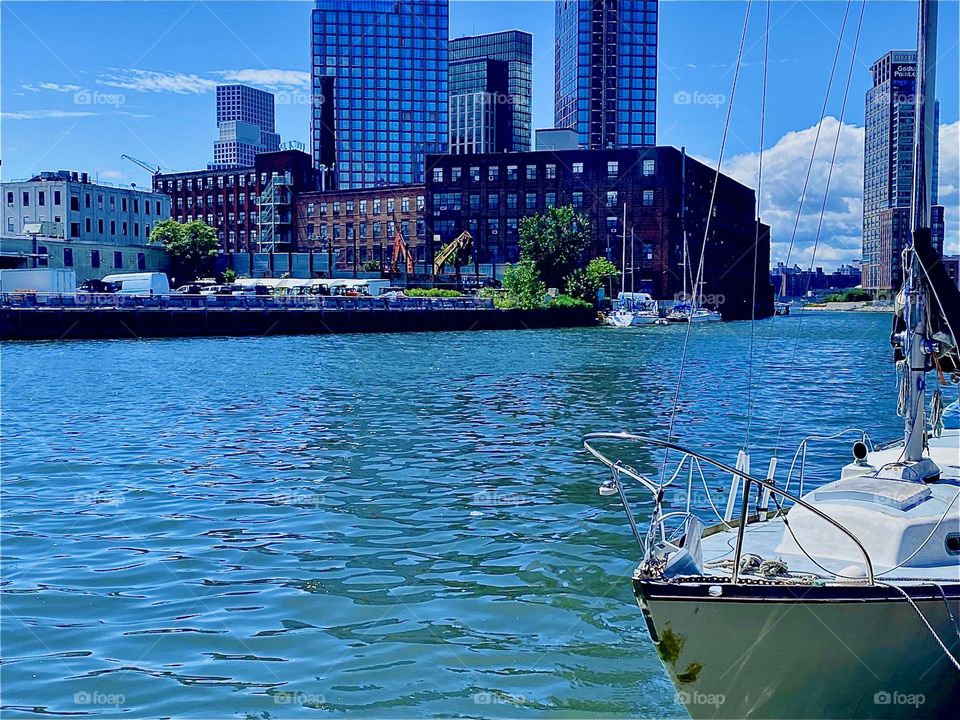 This harbor motif comes to us from „Newtown Creek“ by the „Pulaski Bridge“ in LIC, Queens. Centrally located views all around the boroughs can be experienced here. Across the „E River“ we see „Greenpoint“, Bklyn. 2023. Hypnotic Productions