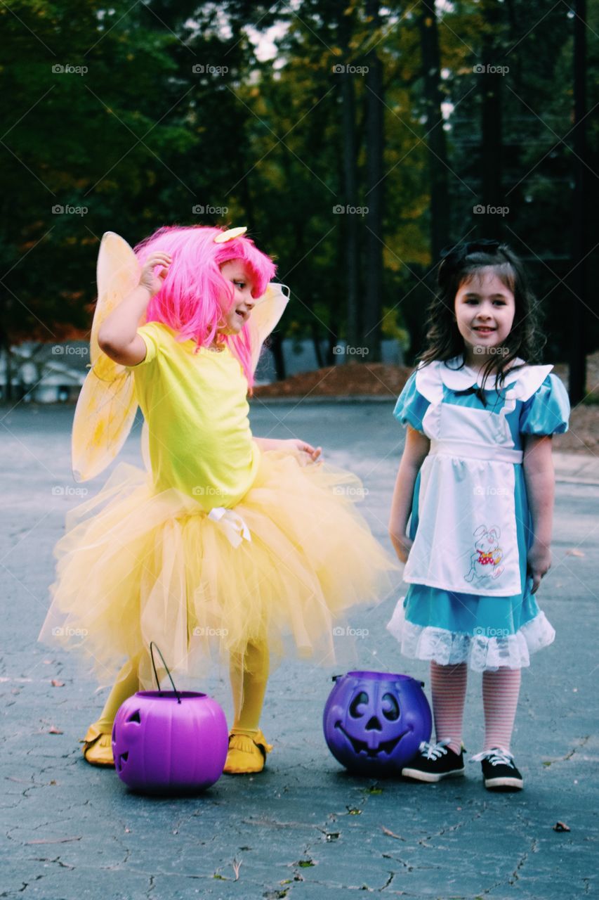 Two little girl with halloween basket