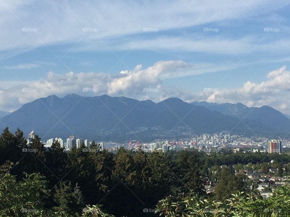A view of downtown Vancouver, British Columbia from Queen Elizabeth Park in a warm sunny summer evening.