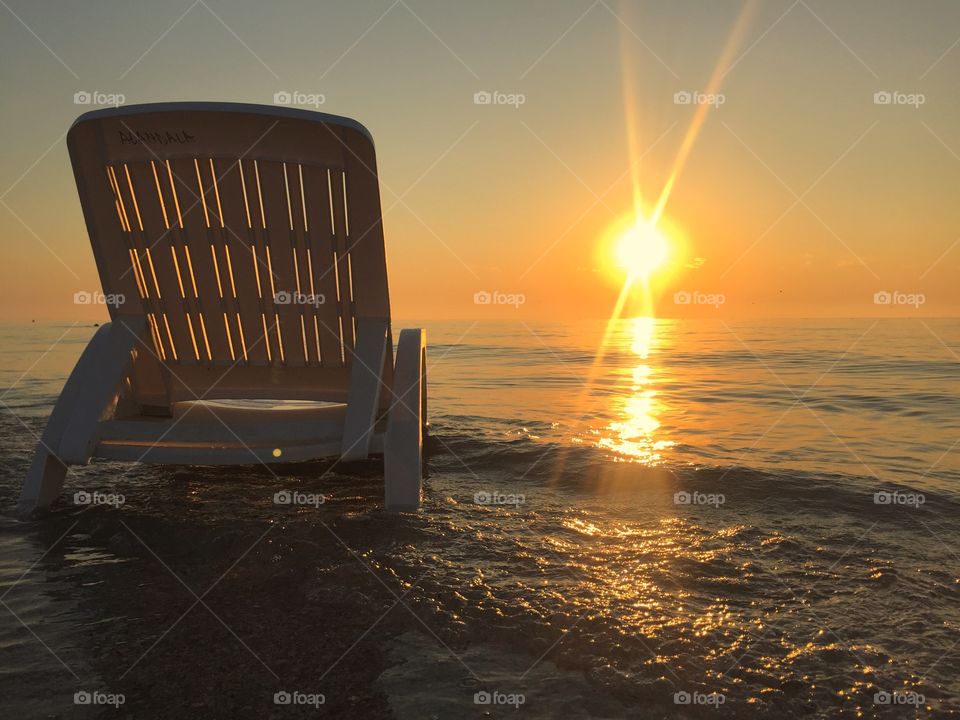 Sunbed sitting in the sea in the sunshine