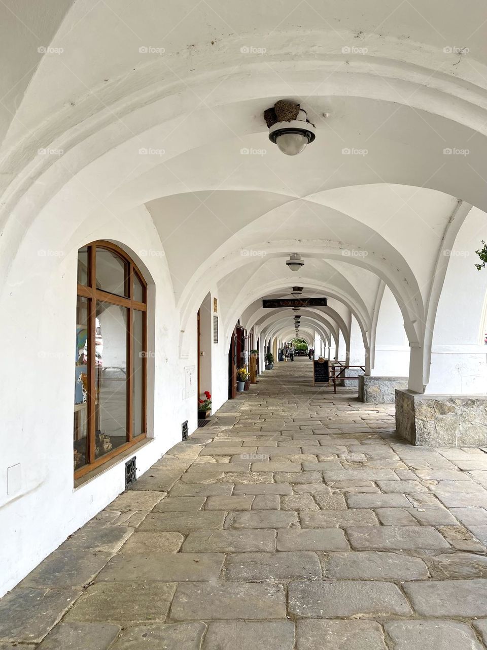 Alley with white arches. Architecture in Europe 