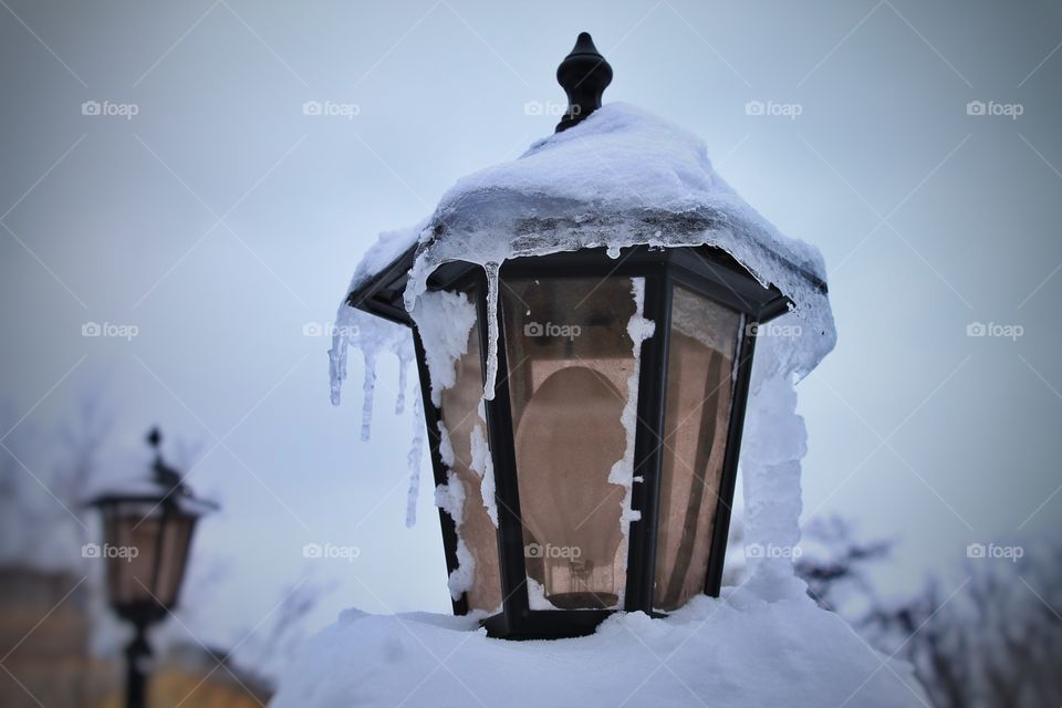 Lantern under the snow. Severe frosts.