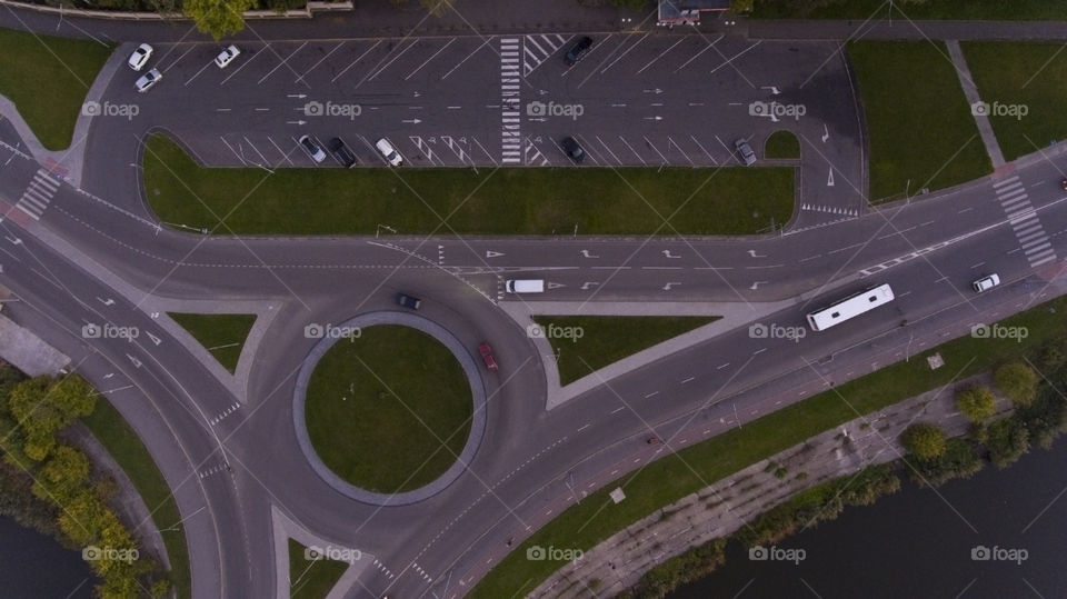 Parking and round road with cars, view from above 