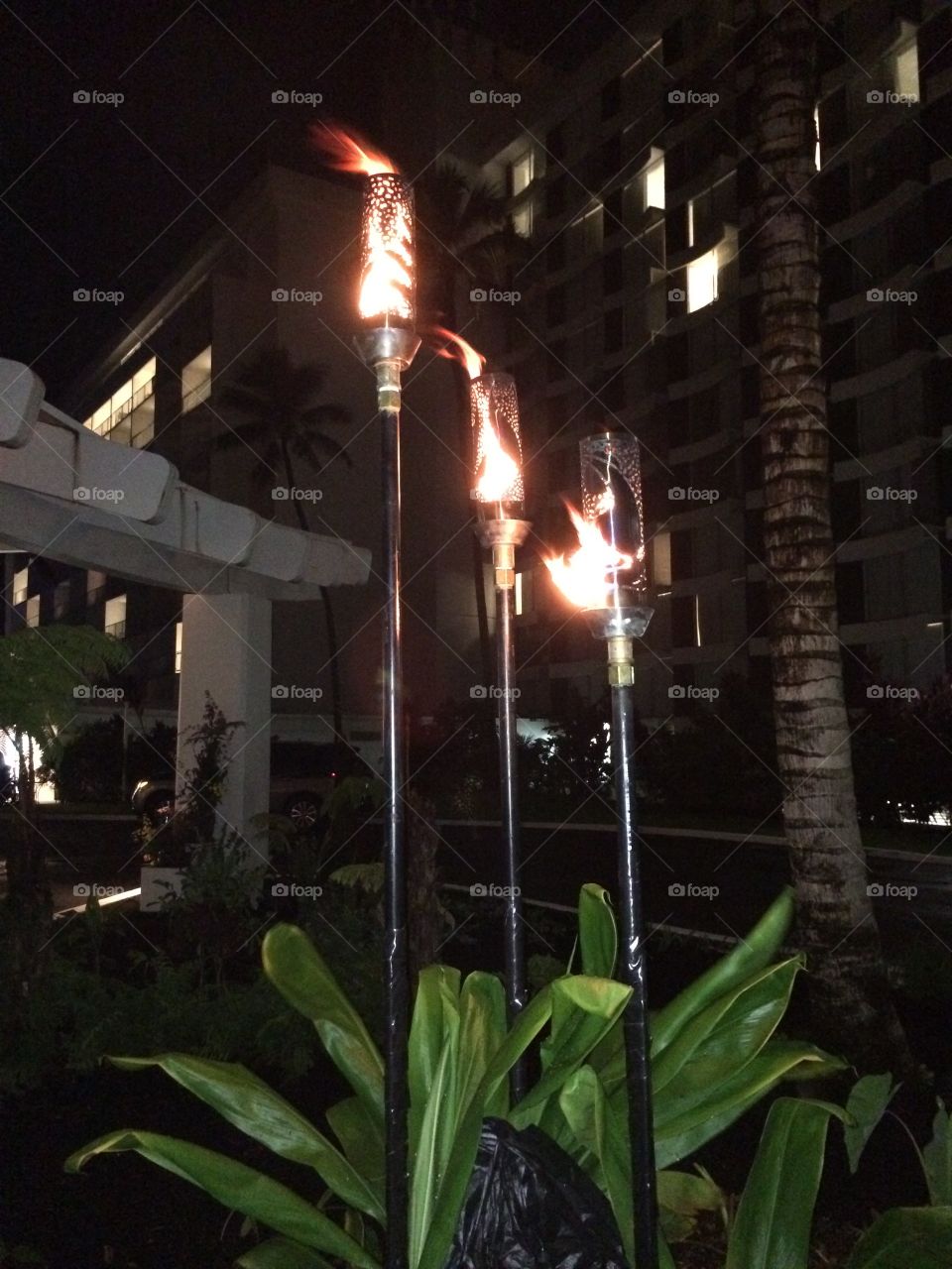 Flaming torches at Naniloa Hotel Hilo Hawaii