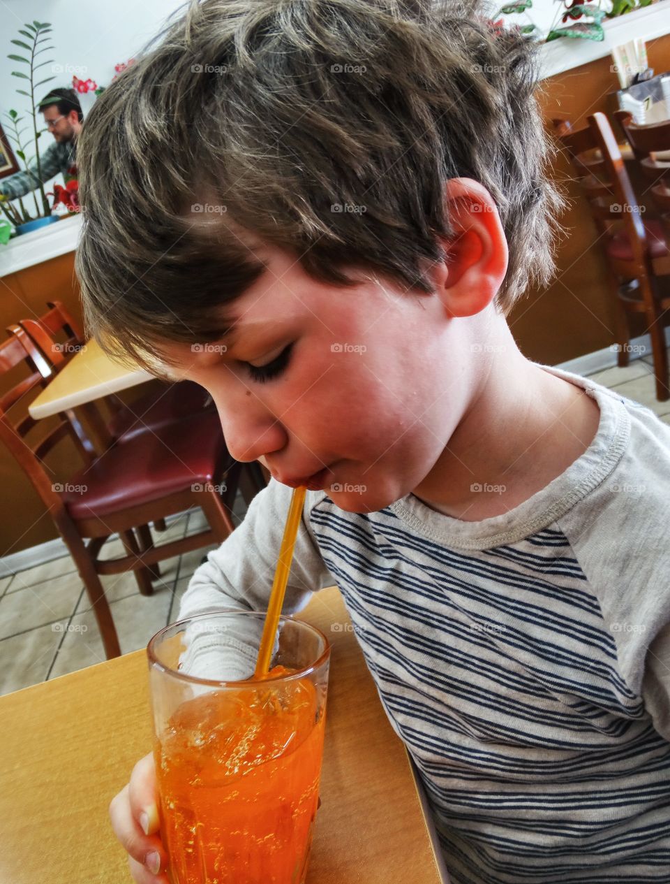 Little Boy Drinking Orange Soda