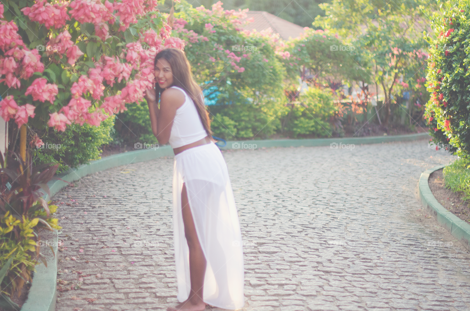 Beautiful woman standing in garden