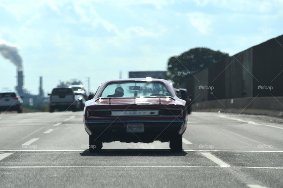 A high speed pursuit chases down a classic Dodge Charger on the New Jersey turnpike southbound.