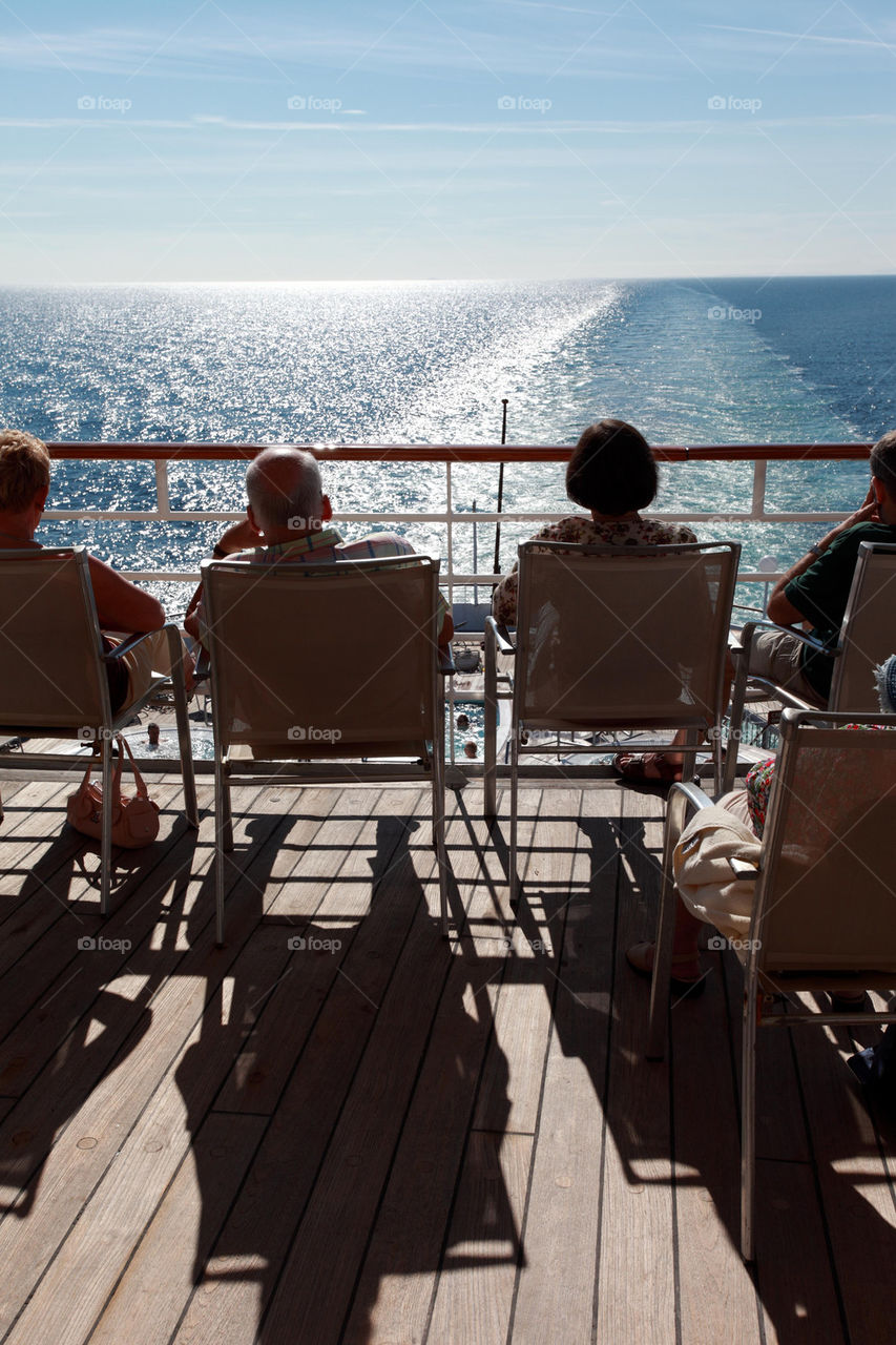 Holidaymakers aboard a cruise ship
