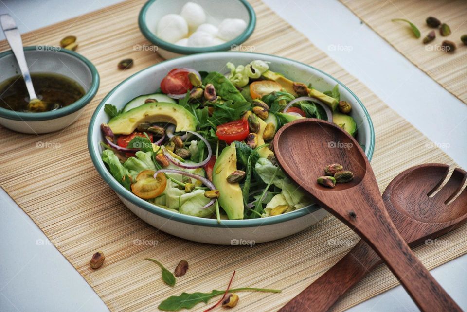Summer salad with vegetables, avocado and mozarella 