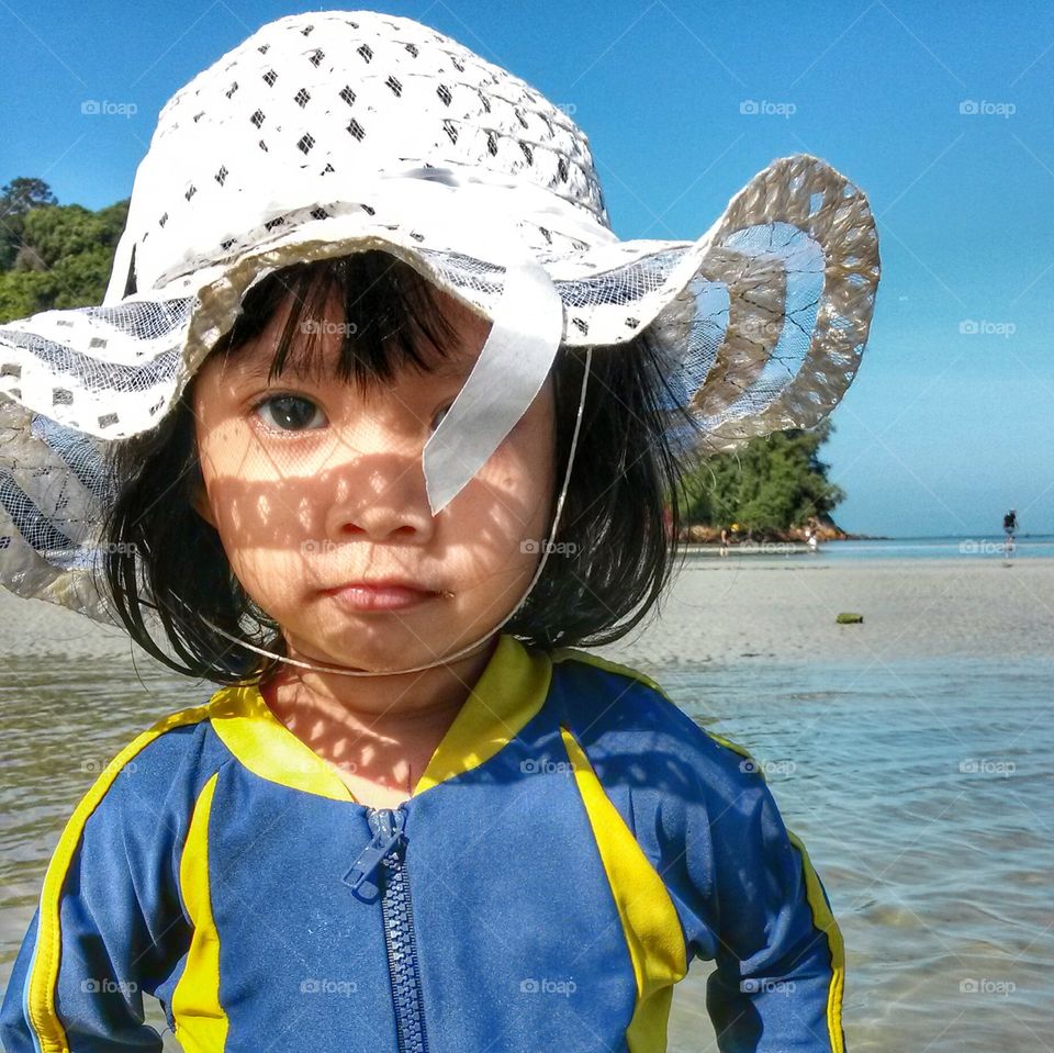 summer holiday. the white hat girl.