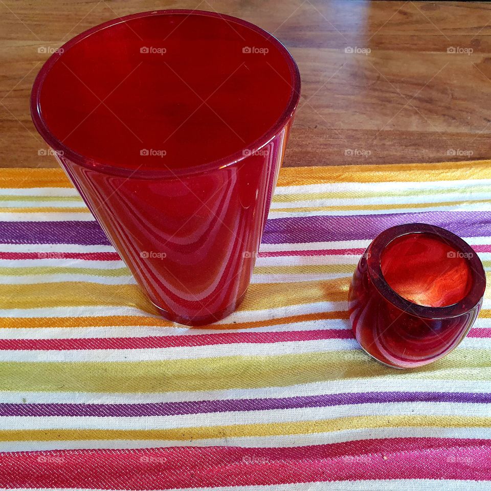 Two beautiful red decorative home products Vase and candle holder