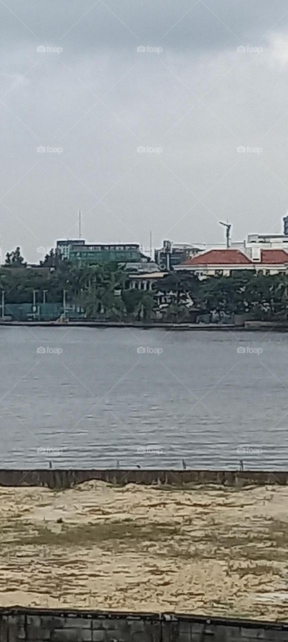 Urban houses beside the ocean lagoon..Such calming , serene landscape. Very relaxing ambience.