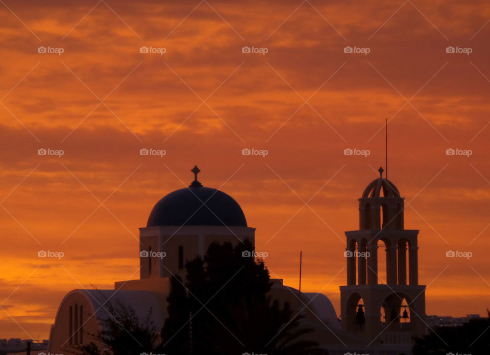 Orange Gradation of the Sunrise Sky over the Church in Santorini Island, Greece