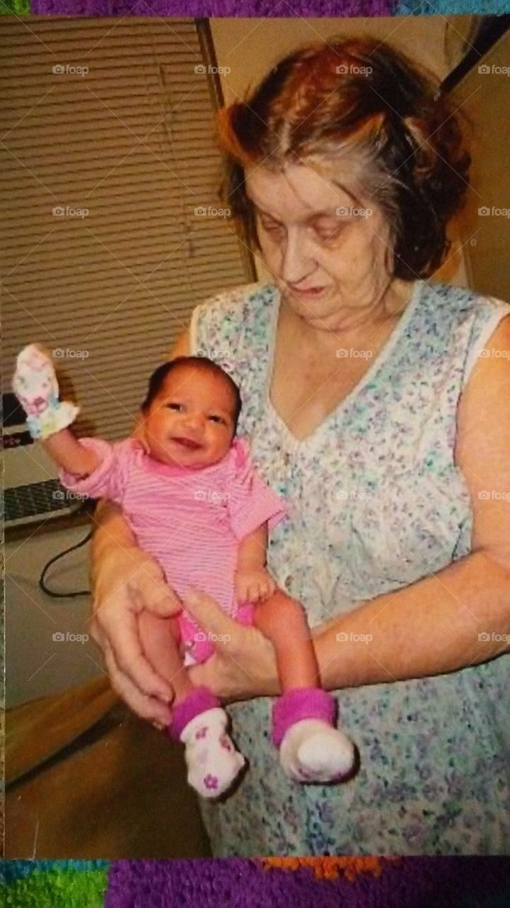 grandma and new born baby waving. amazing