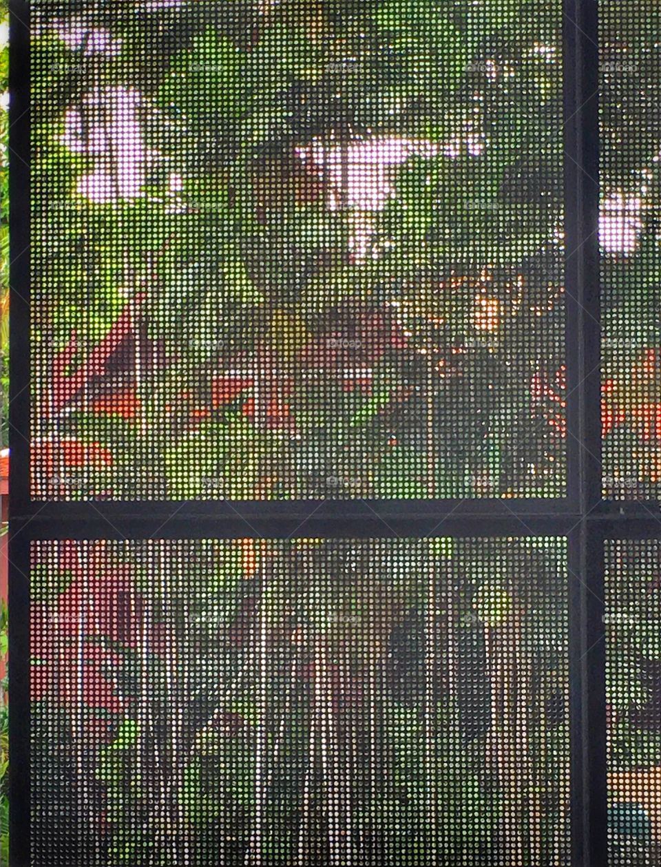 Saving energy building used meshes as wall.View of Thailand traditional house through the meshes.