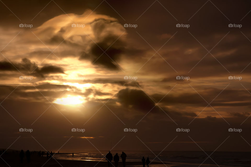 Sunset with beautiful clouds on the beach