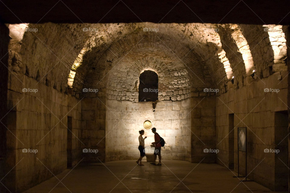 People exploring the basement of diocletians palace in split, Croatia 