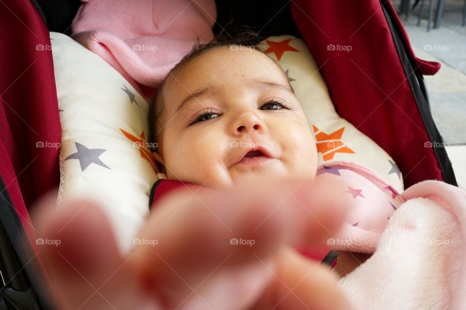 little girl hand touching the camera