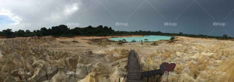 Magical Boardwalk to crystal blue lake surrounded by White sand dunes 