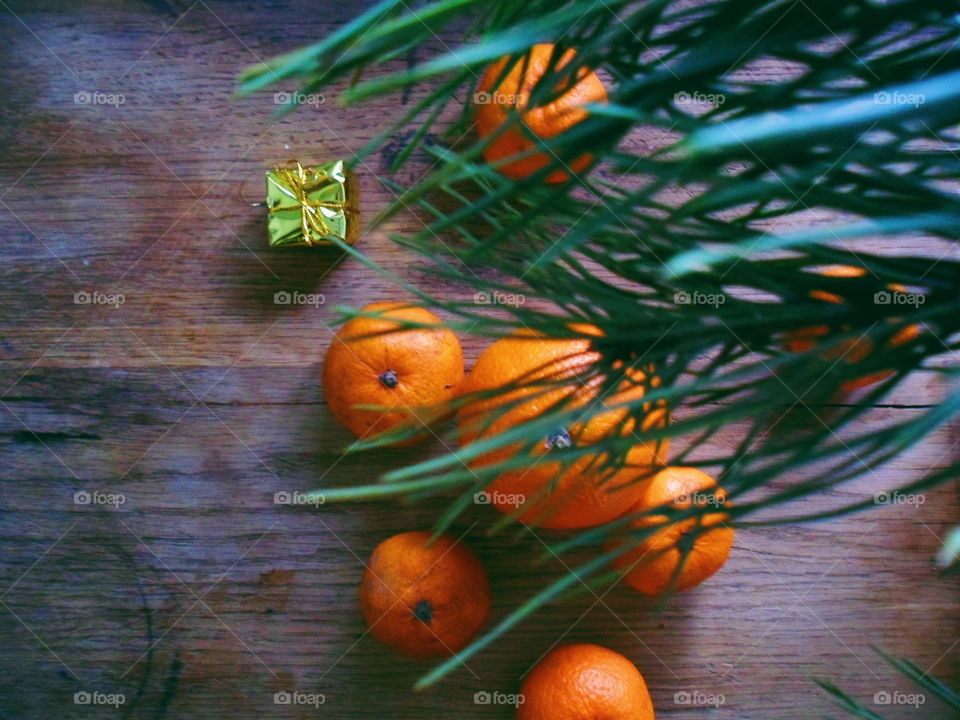 orange and tangerines are on the table