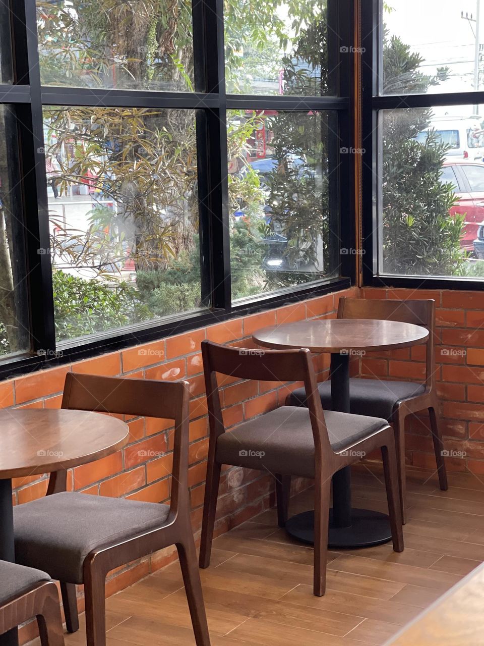 A seating area in a local coffee house with beautiful views 
