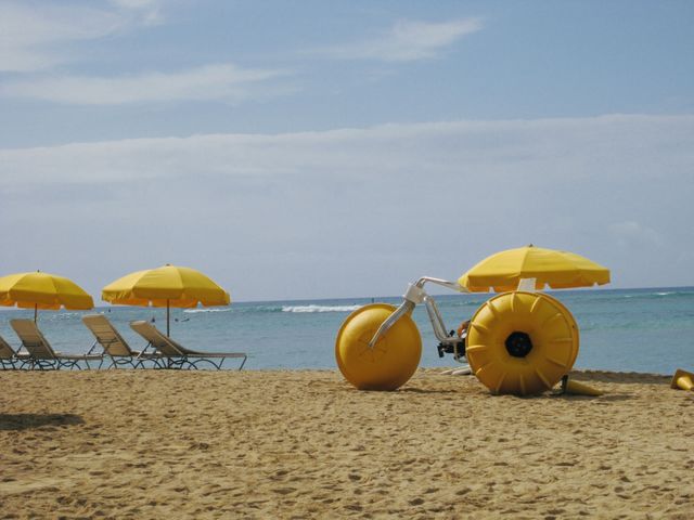 Honolulu, Hawaii, USA. One of the beaches that have deck chairs and a huge water bicycle to ride out to sea. 