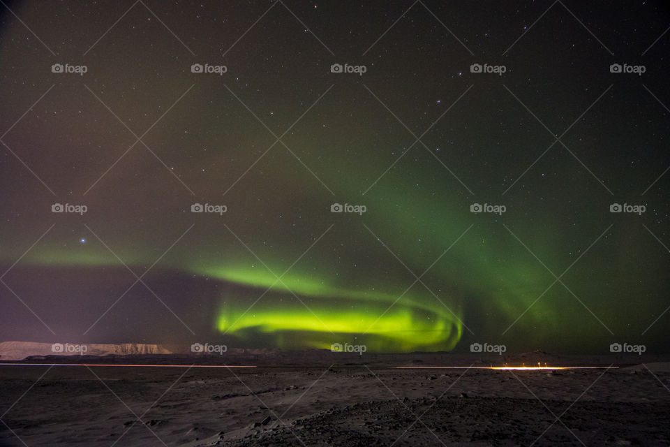 View of a aurora borealis over the sand
