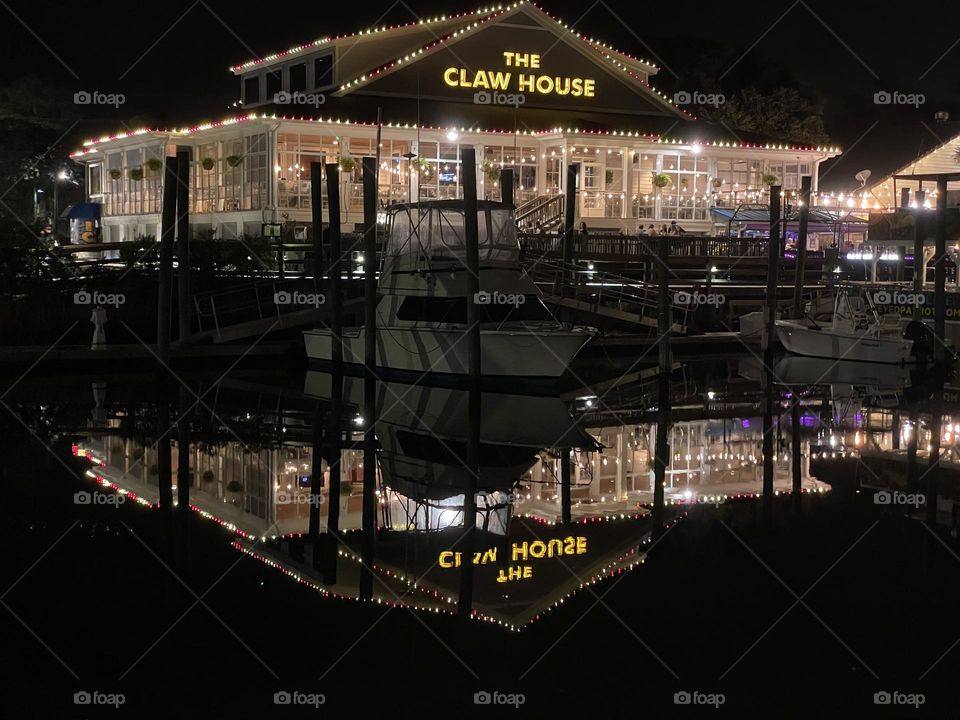 Twinkling lights reflecting in the water at the quay 