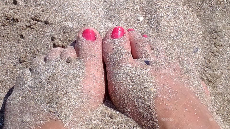 Legs on sand