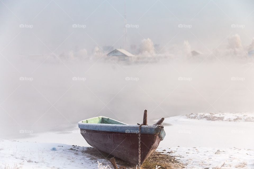 Boat on the frozen lake