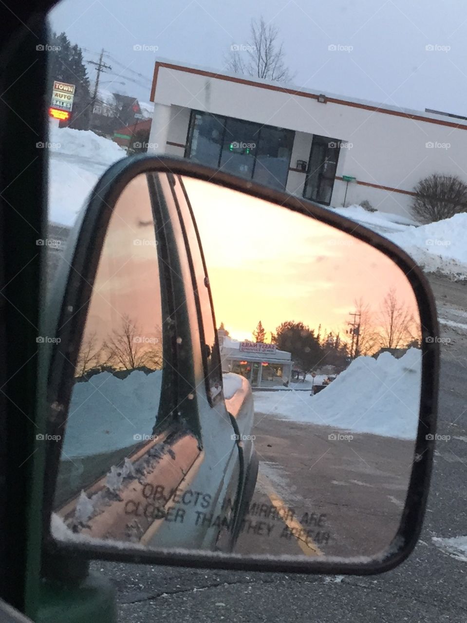 Sunrise in the rear view mirror. Sunrise in the rear view mirror.  During the winter in Maine.