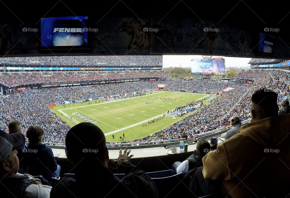 People at a football stadium titans Nissan Stadium Tennessee