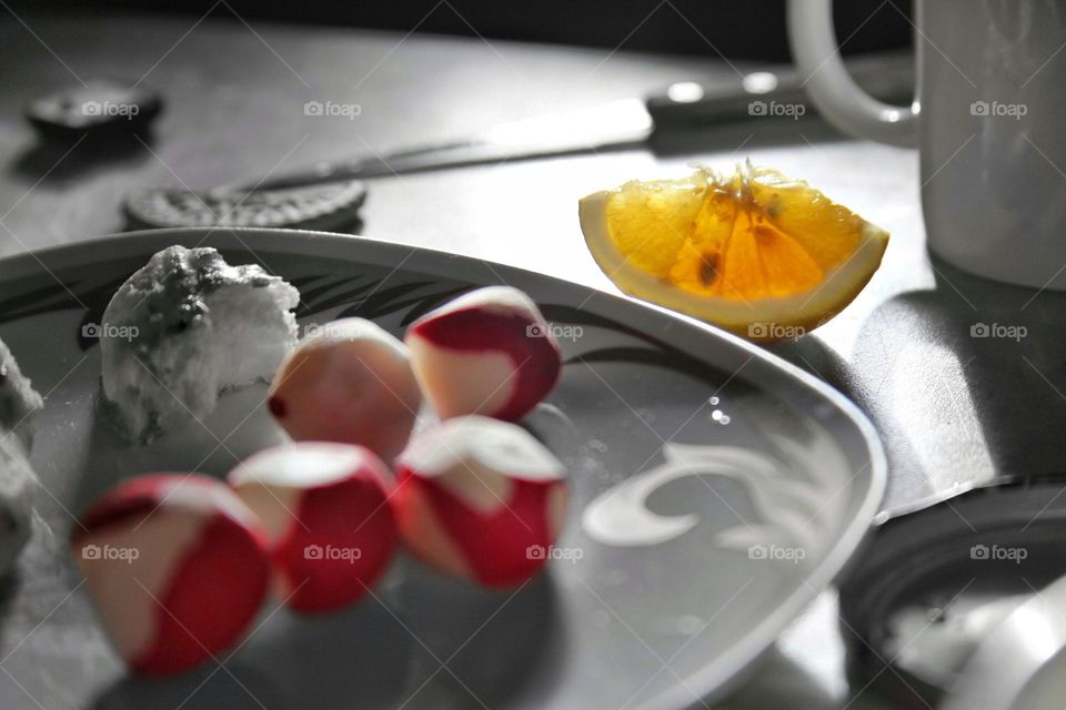 on the table lemon radishes fruits vegetables and mess