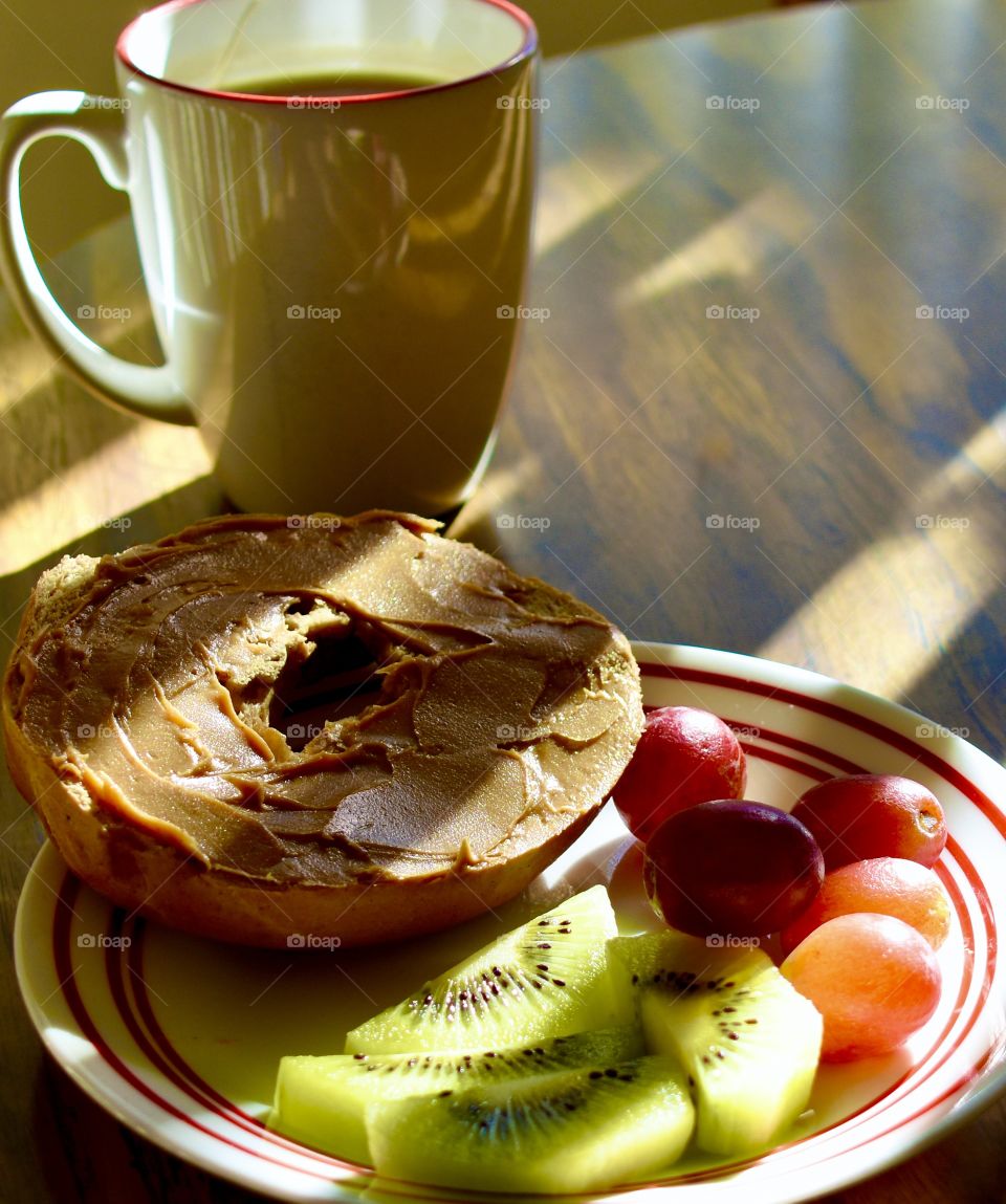 Breakfast still life bagel with peanut butter and fruit 