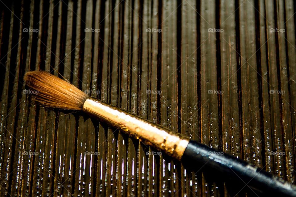 Close-up of wet paintbrush