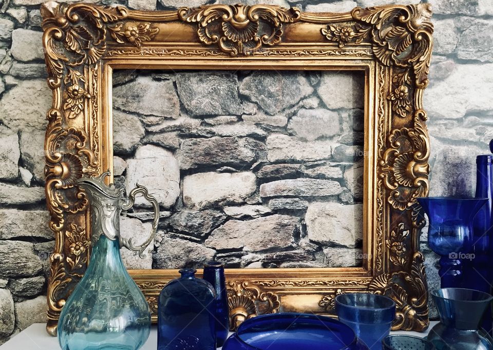 Gold Frame with blue bottles 
