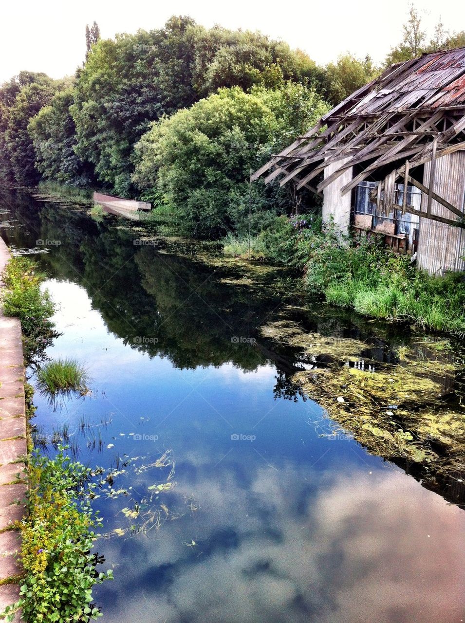 Sky reflected on Leeds canal