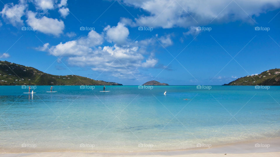 People surfing in sea