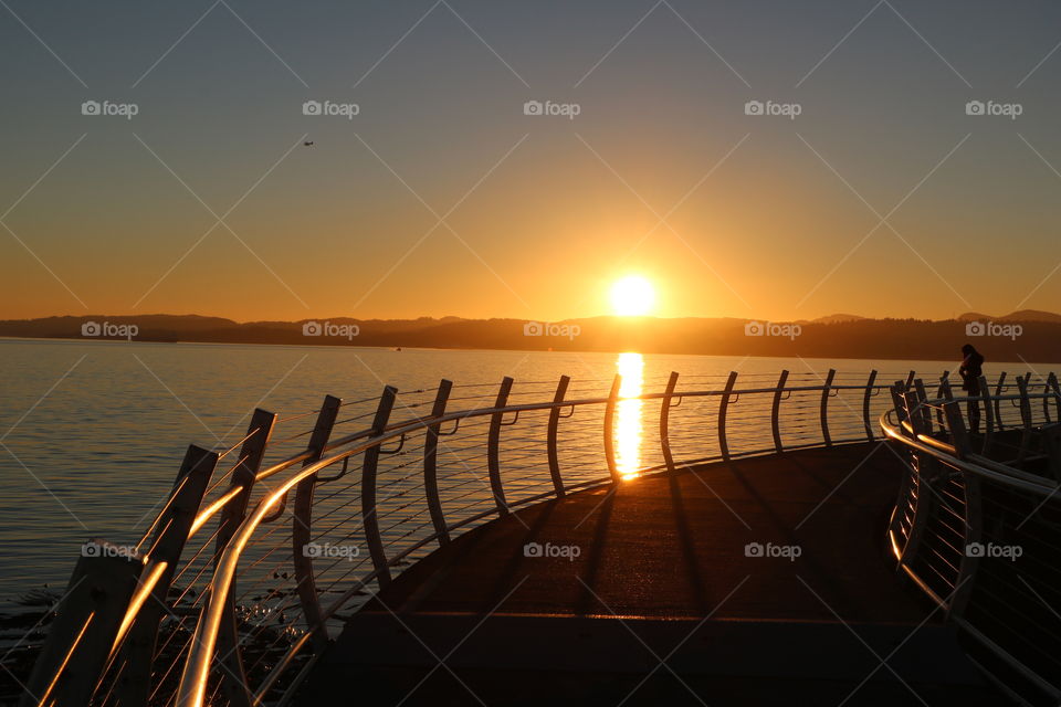 Sunset over breakwater 