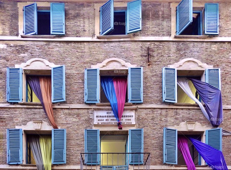 windows with colored curtains