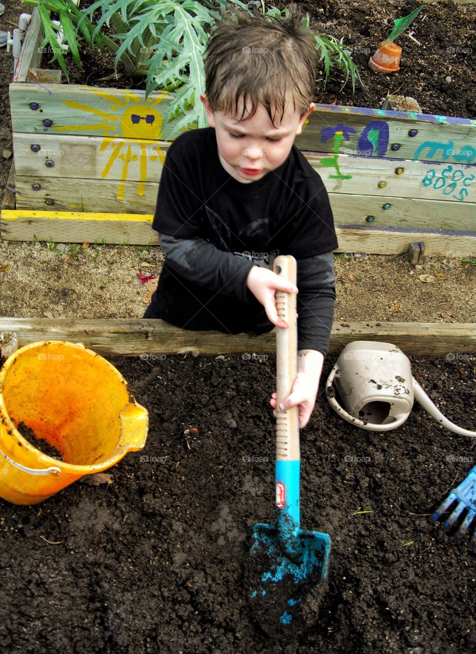 Young Boy Gardening
