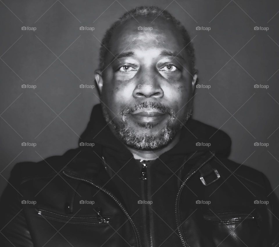 black and white portrait of a man with a gray beard