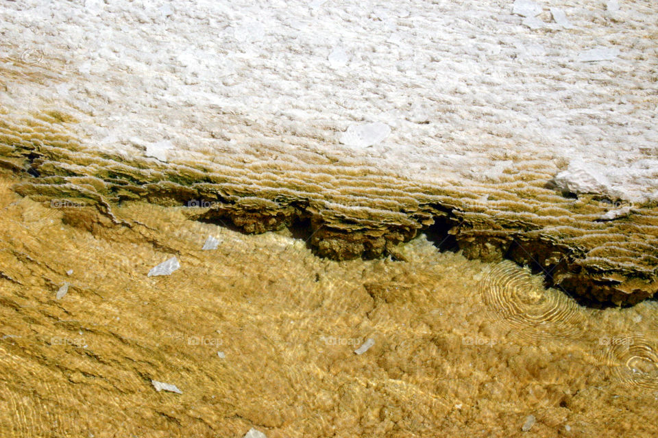 Layered mineral deposits in a hot spring at Yellowstone National park