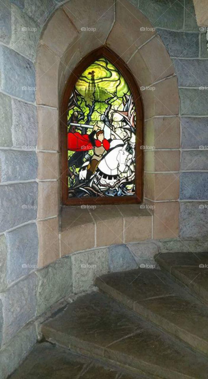 Disney land Paris / Euro Disneys
one of Sleeping beauty castles
stain glass window
(series available )
Sleeping Beauty Castle is the fairy tale structure castle at the center of Disneyland Park, Hong Kong Disneyland and Disneyland Paris. It is based on the late-19th century Neuschwanstein Castle in Bavaria, Germany,with some French inspirations (especially Notre Dame de Paris and the Hospices de Beaune).