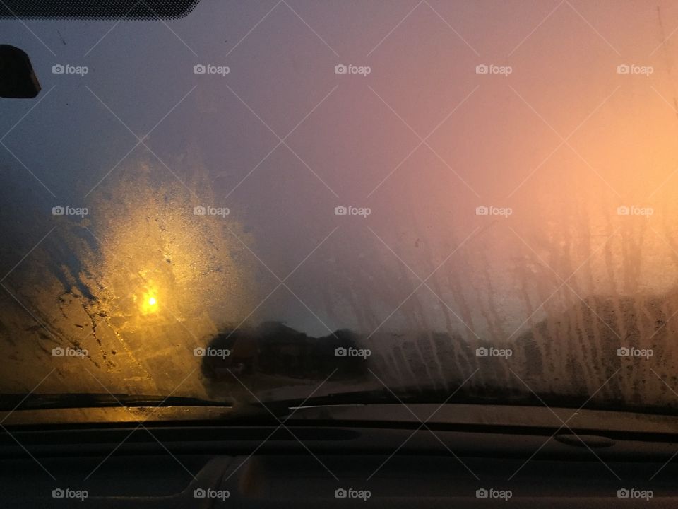 View of dramatic sky from inside a car