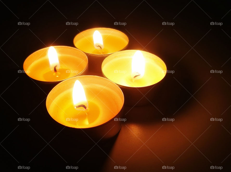 Tealight candles with blurred dark background