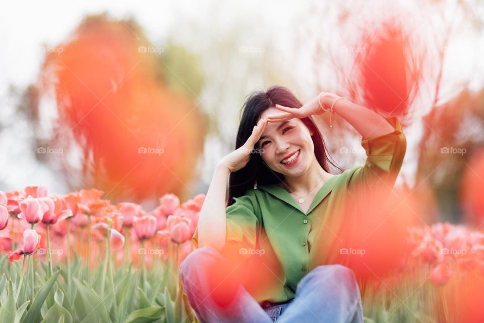 Candid lifestyle portrait of happy asian woman at spring 