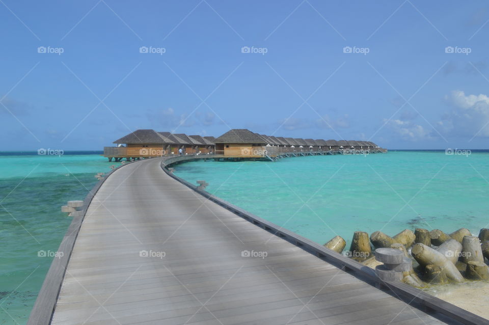 Walking home to our water villa on the boardwalk over the Indian Ocean, we love the Maldives! A special place for honeymoon.