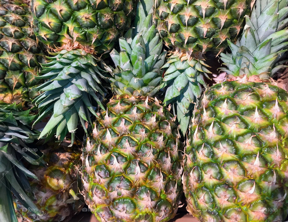 Freshly stacked pineapples